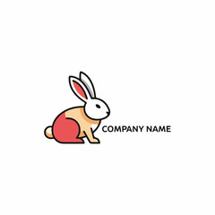 Fototapeta premium Adorable baby rabbit with soft fluffy fur sitting calmly in a beautiful spring garden.