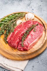 Raw beef marbled steak, Australian Oyster Top blade steak. grey background. top view