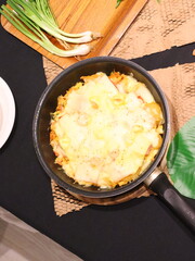 Double cheese pineapple pizza served in a hot pan, rich, cheesy, and delicious with a tropical twist.