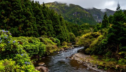 Lush green valley with a flowing river, vibrant foliage, and a misty mountain backdrop.
