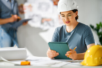 Team of architects working on plans