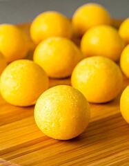 Round, yellow treats on a board