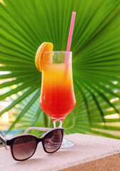 Cocktail on the sea background. Selective focus.