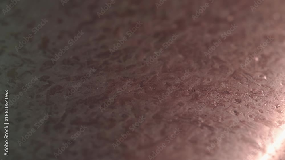 Poster Close-up video shot of a textured surface with soft lighting, highlighting subtle patterns. Captured from a low angle for an abstract effect. Live desktop wallpaper.