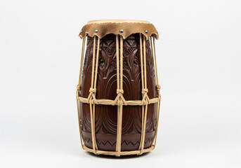 A traditional wooden barrel drum featuring intricate carvings and a rawhide head, a classic ethnic percussion instrument for cultural music and rhythm, isolated on a white background
