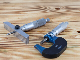 A comprehensive display of precision measuring tools, including a depth micrometer and an external...