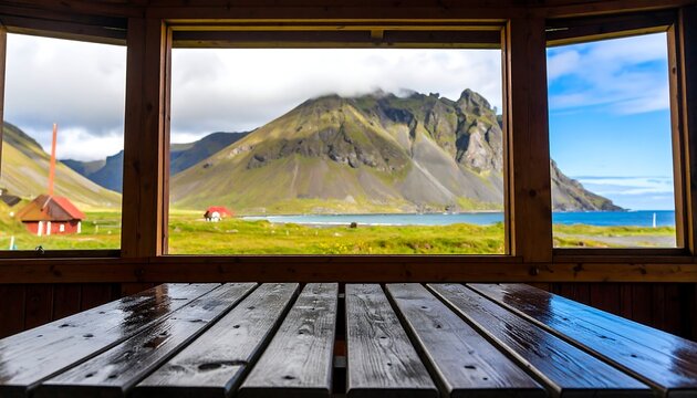 Fototapeta Panoramic mountain view seen through wooden-framed windows from a picnic table