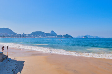 Rio de Janeiro, Brazil, May 19, 2025: Copacabana Beach is a beach located in the Copacabana neighbourhood, in the South Zone of the city of Rio de Janeiro, Brazil. Beautiful blue skies and golden sand