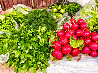 Vibrant assortment of fresh vegetables at a local market during a sunny afternoon