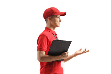 Shop assistant gesturing with hand and holding a document
