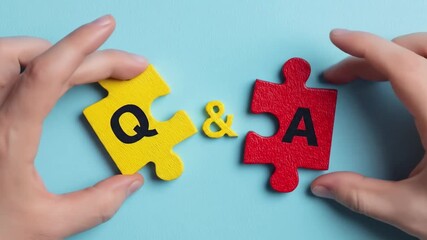 Two puzzle pieces forming Q&A