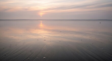 Serene Sunset Over Calm Beach with Reflective Water and Soft Pastel Colors