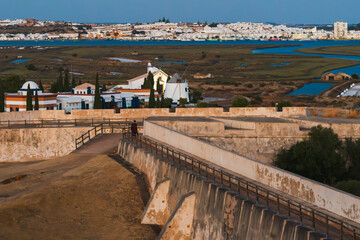 Ancient walls of Castro Marim Fortress, Portugal, provide a view across the river to Spain.