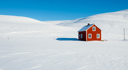 Cozy red cabin nestled in vast snowy landscape under clear blue sky, symbolizing winter serenity and isolation