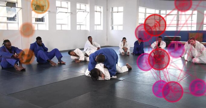 Instructor tapping partner to start jiu jitsu training with animated arrows showing control shifts