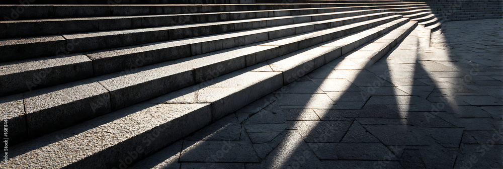 Poster abstract architectural view of sunlit stone stairs with long, dramatic shadows. minimalist backgroun