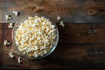 Pop corn on wood color background.Food and snack concepts ideas.Minimal style top view mockup