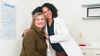 Diverse Female Doctor and Older Patient Smiling Together During a Positive Medical Consultation