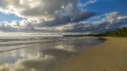 Waves of pure blue crash gently on Bainema Beach, a pristine escape on Boipeba Island in Brazil’s Bahia.