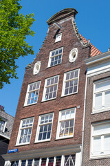 Beautiful cityscape view of the city of Amsterdam as seen from the canal and bridges.