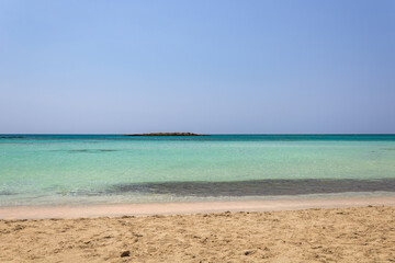 Sandy shoreline and turquoise waters at Elafonissi beach Crete