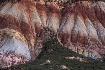 Colorful erosion patterns of Painted Hills showcase unique geological features