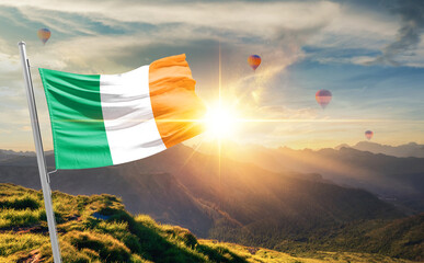 Ireland flag waving in beautiful scenery. Ireland national flag for independence day.