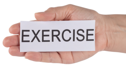 A hand holds a card displaying the word "EXERCISE" in bold, capital letters.
