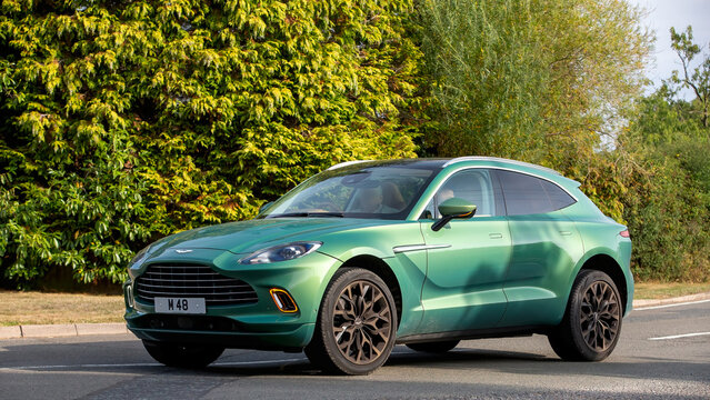 Whittlebury,Norhants,UK - Aug 23rd 2025: 2021 green Aston Martin DBX V8 SUV car driving on a British road