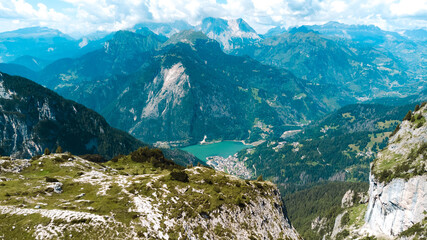Panoramic view of serene mountain lake under clear sky in the Dolomites Italy perfect for nature and travel photography