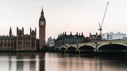 Fototapeta premium Palace of Westminster and Big Ben at night with smooth river reflections, long exposure on the Thames
