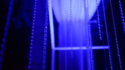 Mesmerizing blue and pink led light beads in motion