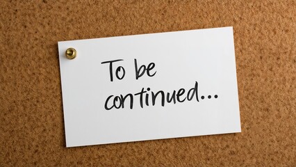 Obraz premium White paper with 'To be continued' pinned on bulletin board