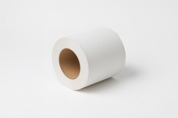 Hollow center of a tissue paper tube. Unused cardboard tube from toilet tissue shown against a plain white backdrop.