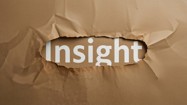 The term Insight visible through ripped brown paper