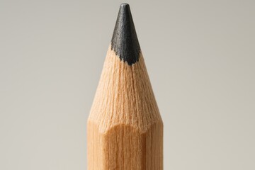 Vertical shot focusing on the sharpened graphite pencil tip