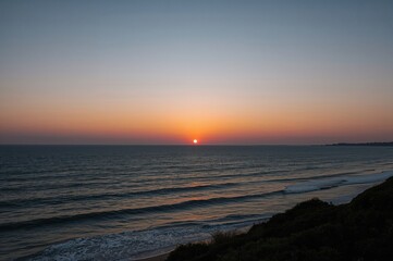 Fototapeta premium Dawn Breaking Above the Ocean at a Coastal Natural Reserve