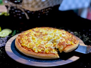Delicious corn cheese pizza with golden melted cheese and sweet corn topping.
