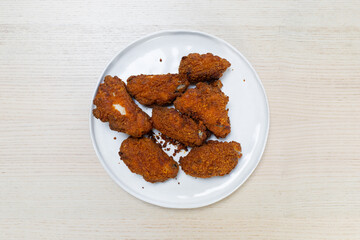 A plate of spicy crispy chicken wings.