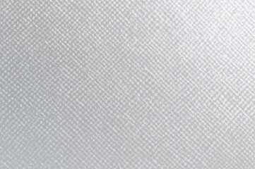 Fototapeta premium Metallic crosshatch texture on a pearlescent silver-gray paper with a glossy finish.
