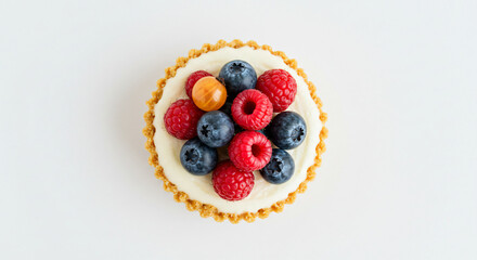 Delicious fruit tart topped with blueberries, raspberries, and gooseberries, presented against a clean white background, close-up overhead view