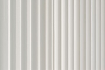 Close-up abstract background of vertical white blinds casting shadow patterns on a wall