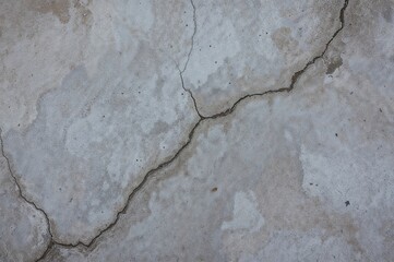 Obraz premium Surface pattern of fractured gray cement