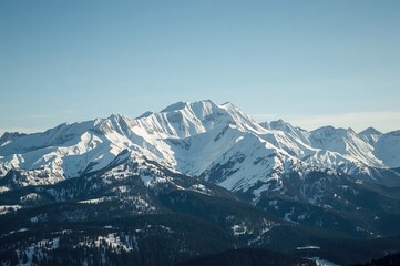 Fototapeta premium Snow-covered peaks in a northern region