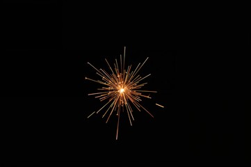 Fototapeta premium Flames and sparks against a dark backdrop