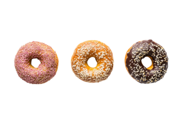 Three delicious donuts with colorful toppings isolated on transparent background. Fresh bagel top view isolated on white background.