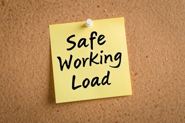 Yellow note pinned on corkboard with white pushpin indicating safe working load, space for text
