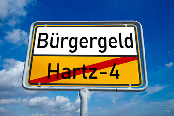 Obraz premium Bürgergeld ersetzt Hartz IV – symbolischer Richtungswechsel azs Ortssschild