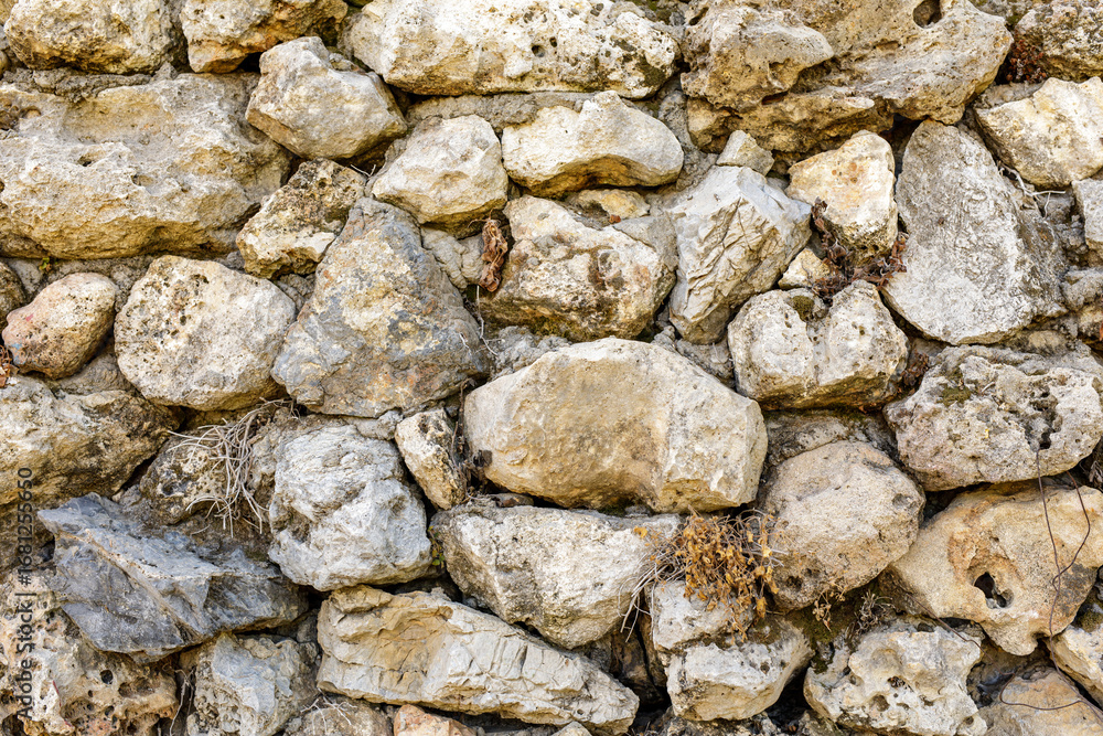 Poster high-resolution image of a rustic stone wall, perfect for backgrounds and textures. ideal for design