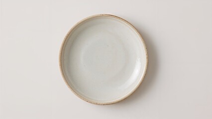 Retro white and blue ceramic plates with a textured matte look resembling sand grains